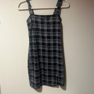 Plaid dress with a small slit on the bottom right.